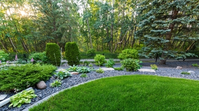 Planted garden with gravel and grass. Photo